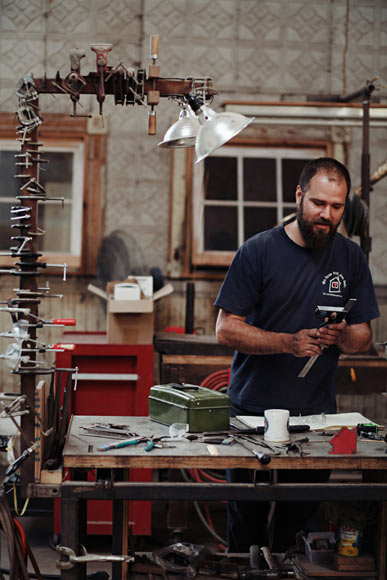 J.R. "Jon" Greig Jr. at his work station.