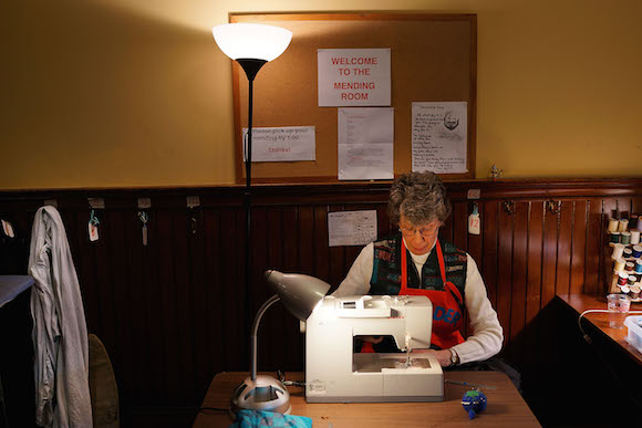 Mending clothes at Broad Street Ministry