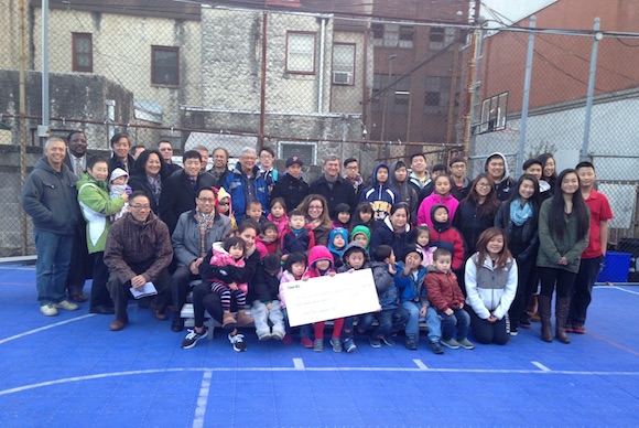 The Philadelphia Suns present a check to Eastern Tower