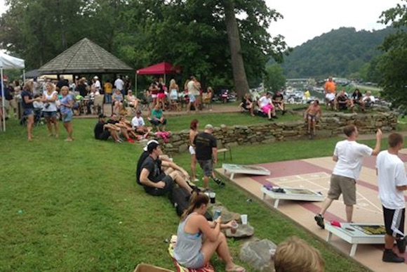 Enjoying green space -- and cornhole -- on the Mon