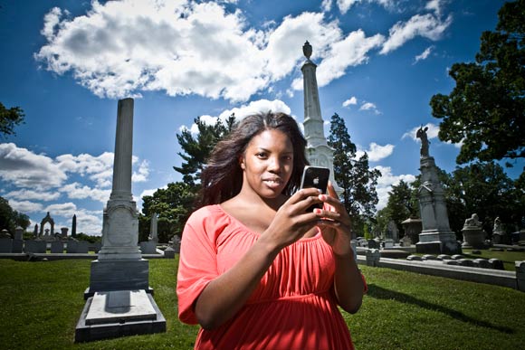 Alexis Jeffcoat tweets as we photograph in Laurel Hill Cemetery