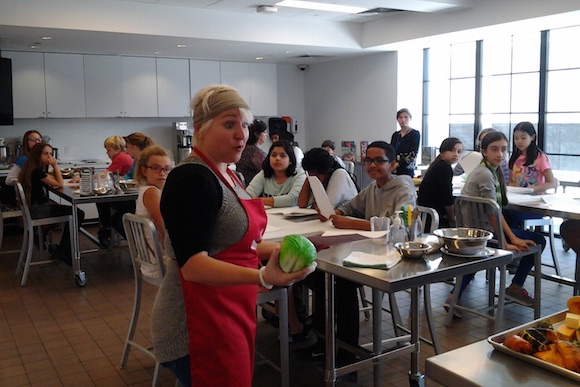 Culinary literacy partner Shayna Marmar addresses the class