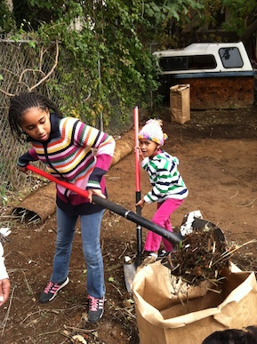 Young Fairhill residents clean a blighted lot near their home