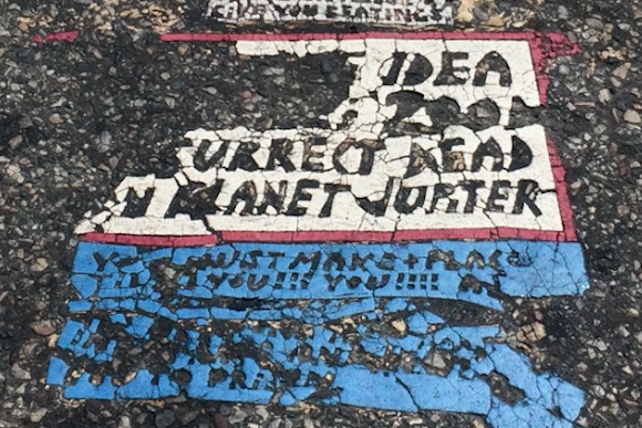 A fading Toynbee Tile at 34th and Chestnut