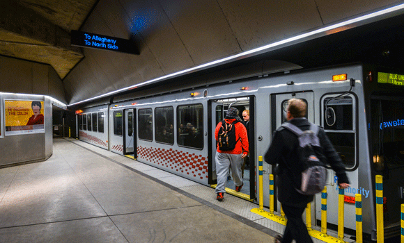 Commuters board the T at Gateway Station, Downtown